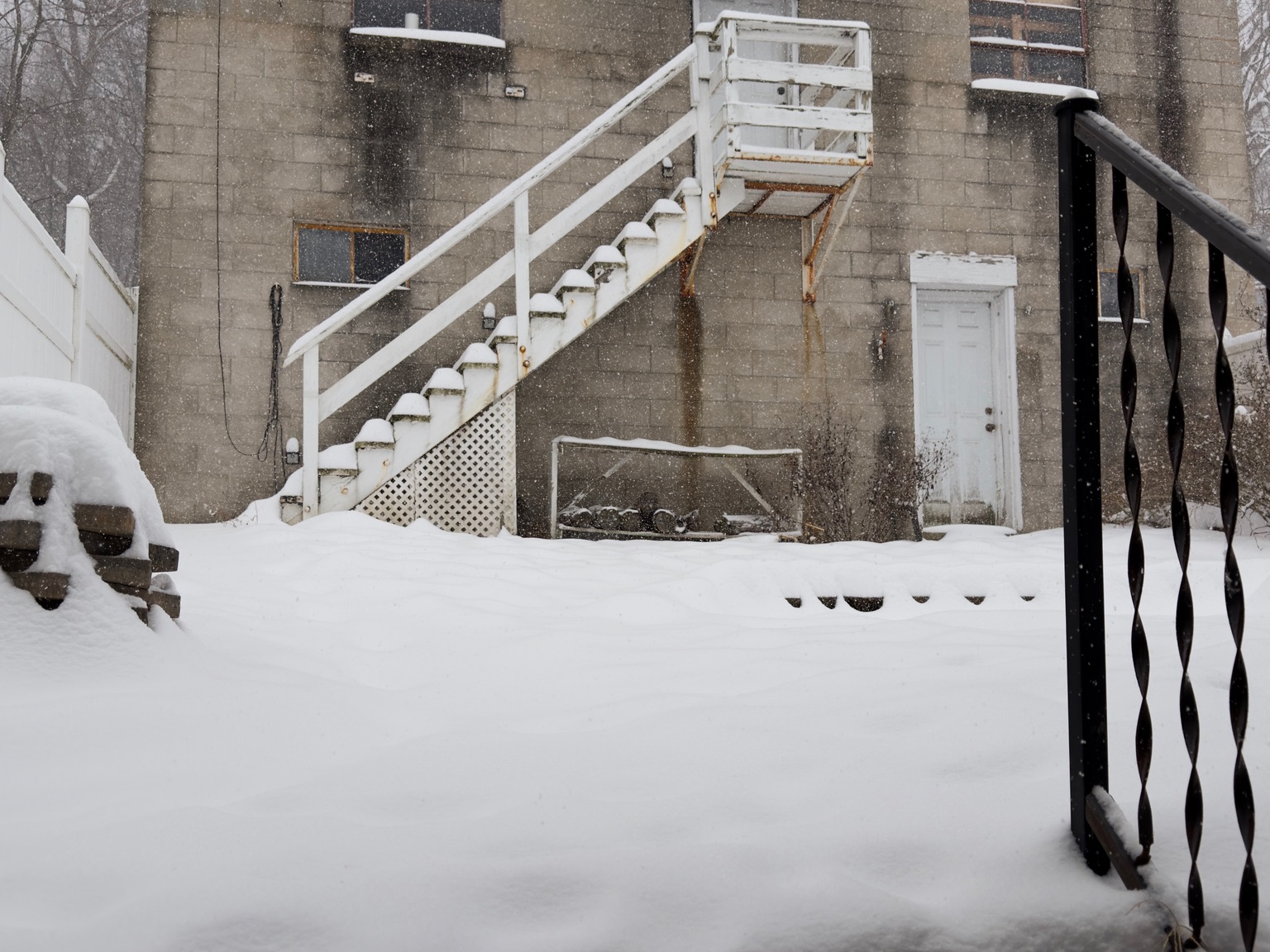 The backyard and garage A snowy yard