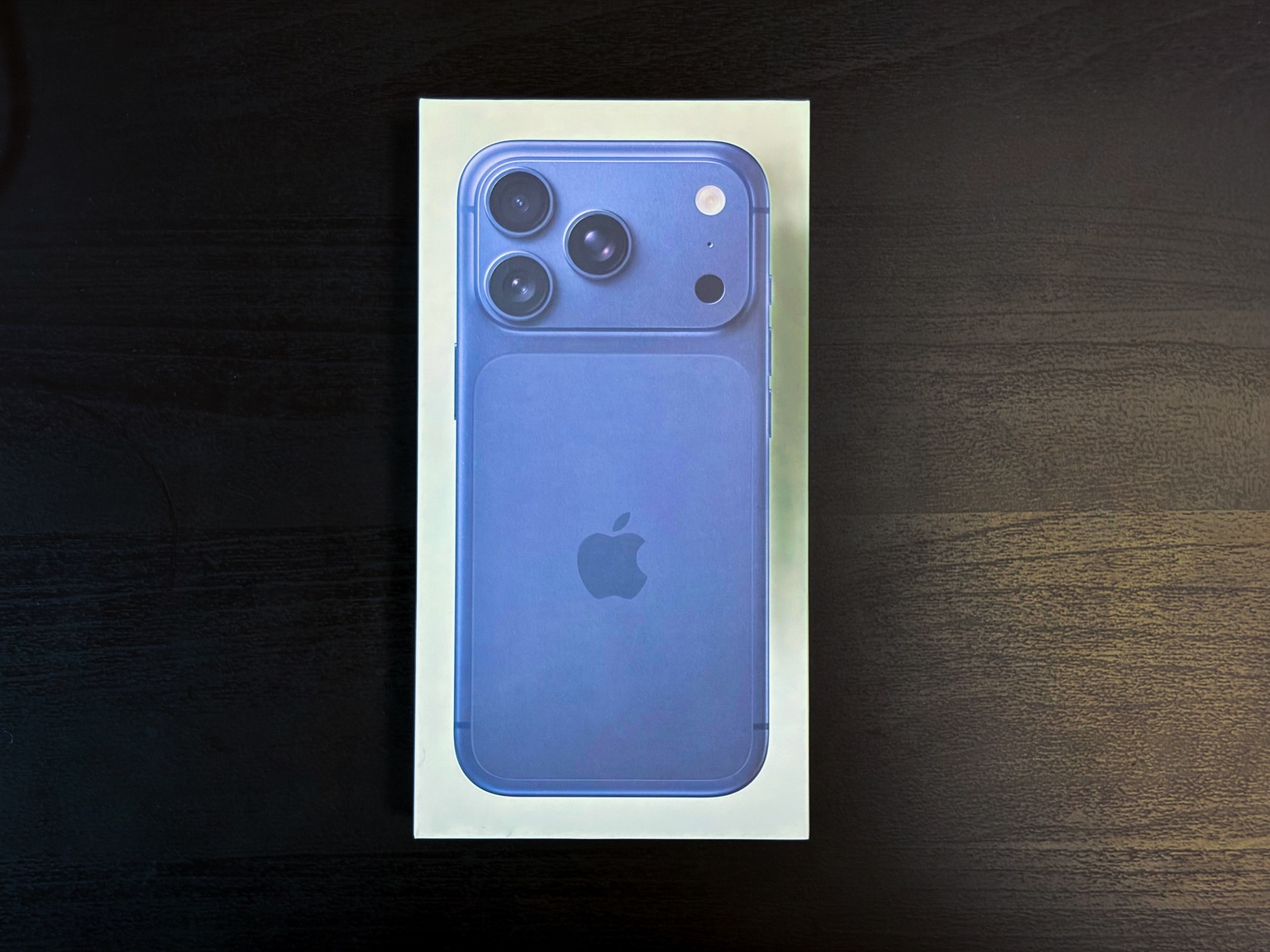 An iPhone 17 Pro in the Deep Blue colorway